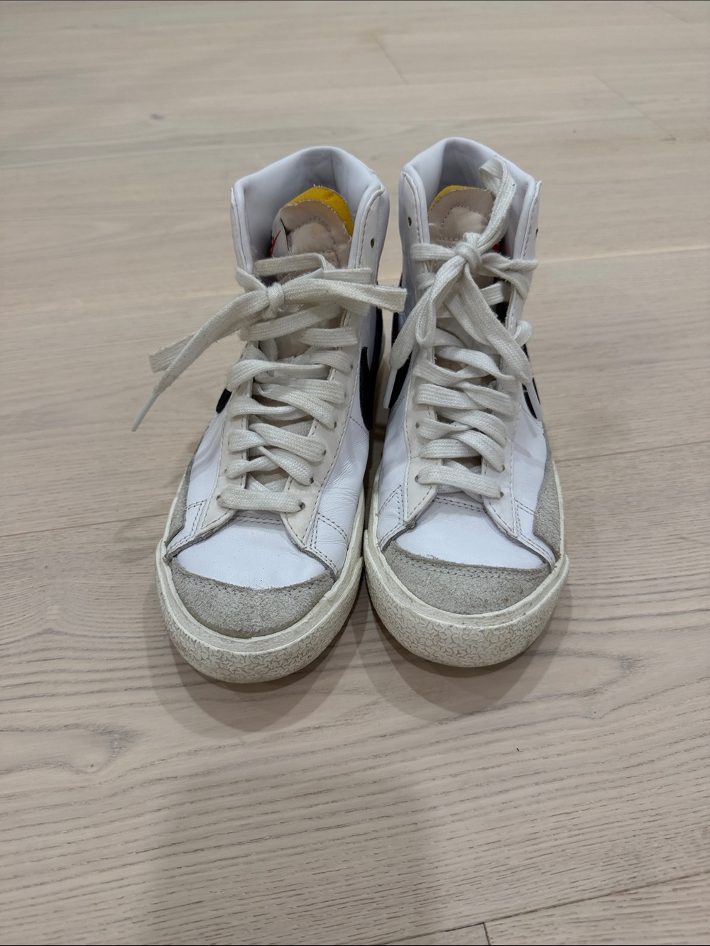 Nike Women’s White High-Top Sneakers with Black Swoosh